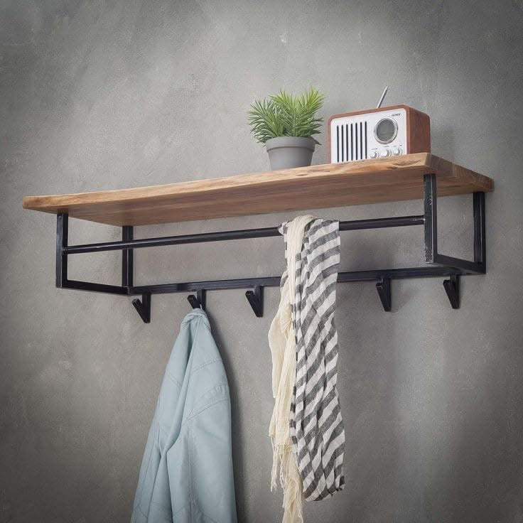 Wall-mounted coat rack featuring a thick, light-colored wooden shelf with a natural edge, resting on a minimalist black metal frame with a hanging rod and six triangular hooks