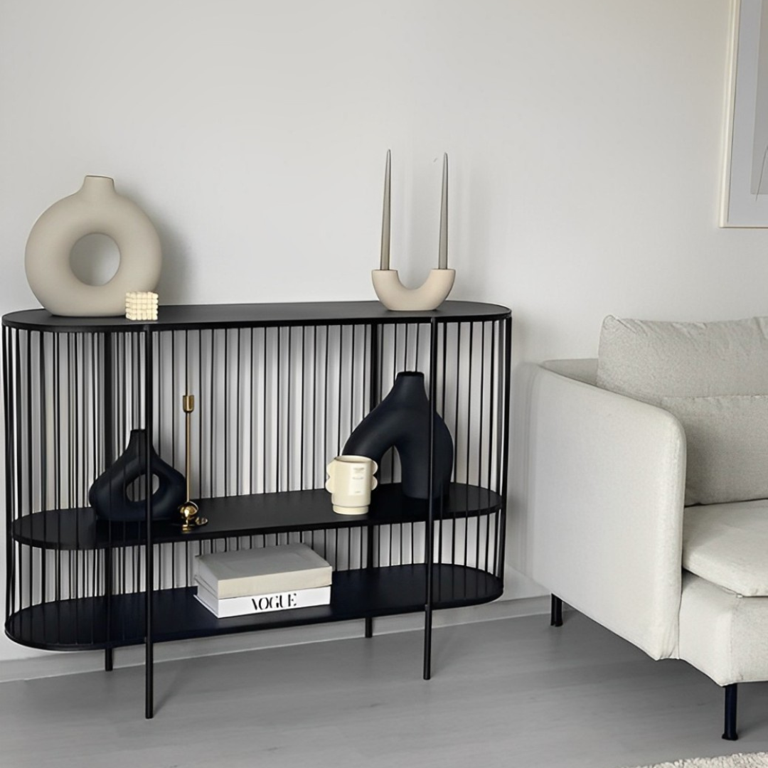 Modern black oval console table with a vertical rod design and two display shelves.
