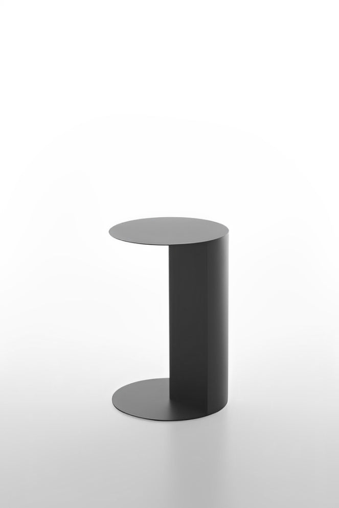 Minimalist dark grey C-shaped side table for sofa or chair.