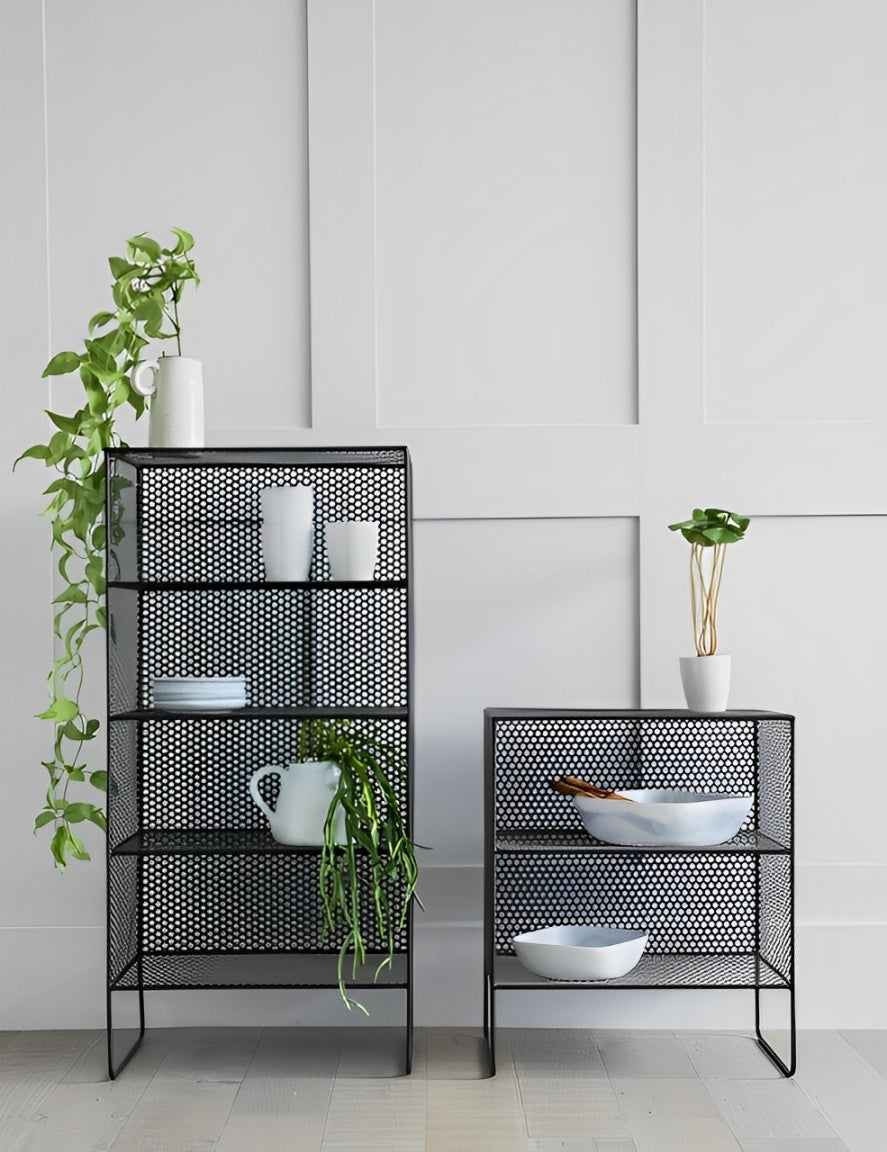 Set of two black wire mesh shelves, one taller with four shelves, one shorter with two. Modern industrial-style storage for home decor in Lebanon, displaying plants and white dishes.