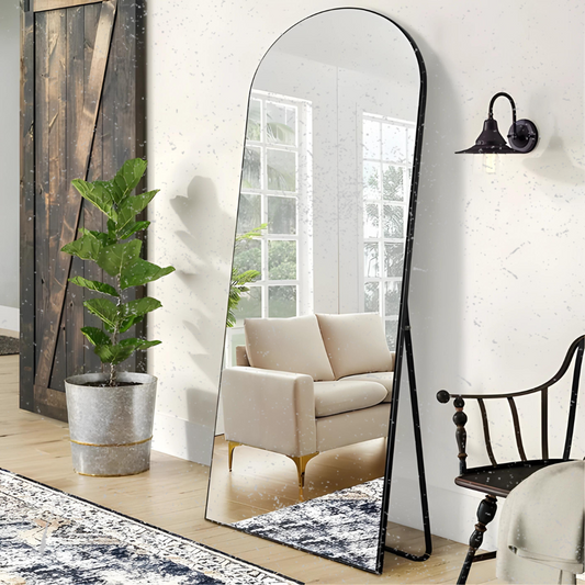 Modern, arched full-length mirror with a minimalist frame, adding a touch of elegance to a contemporary interior.