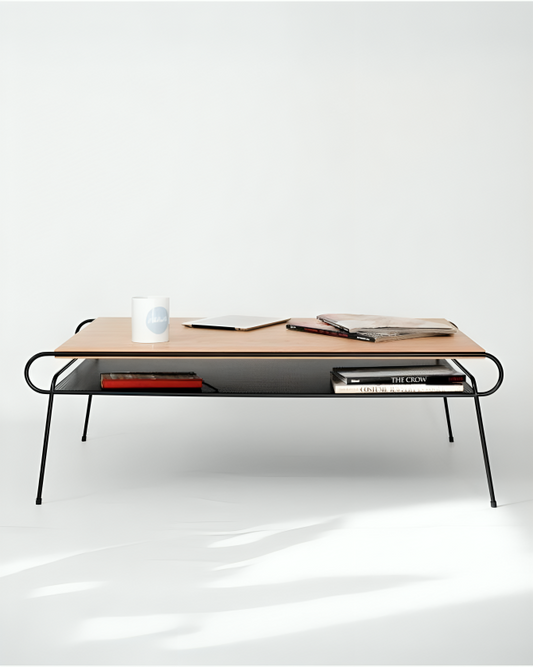 Close-up of HAY Mags Coffee Table. Detail of light wood tabletop, curved black metal frame, and black perforated metal shelf.